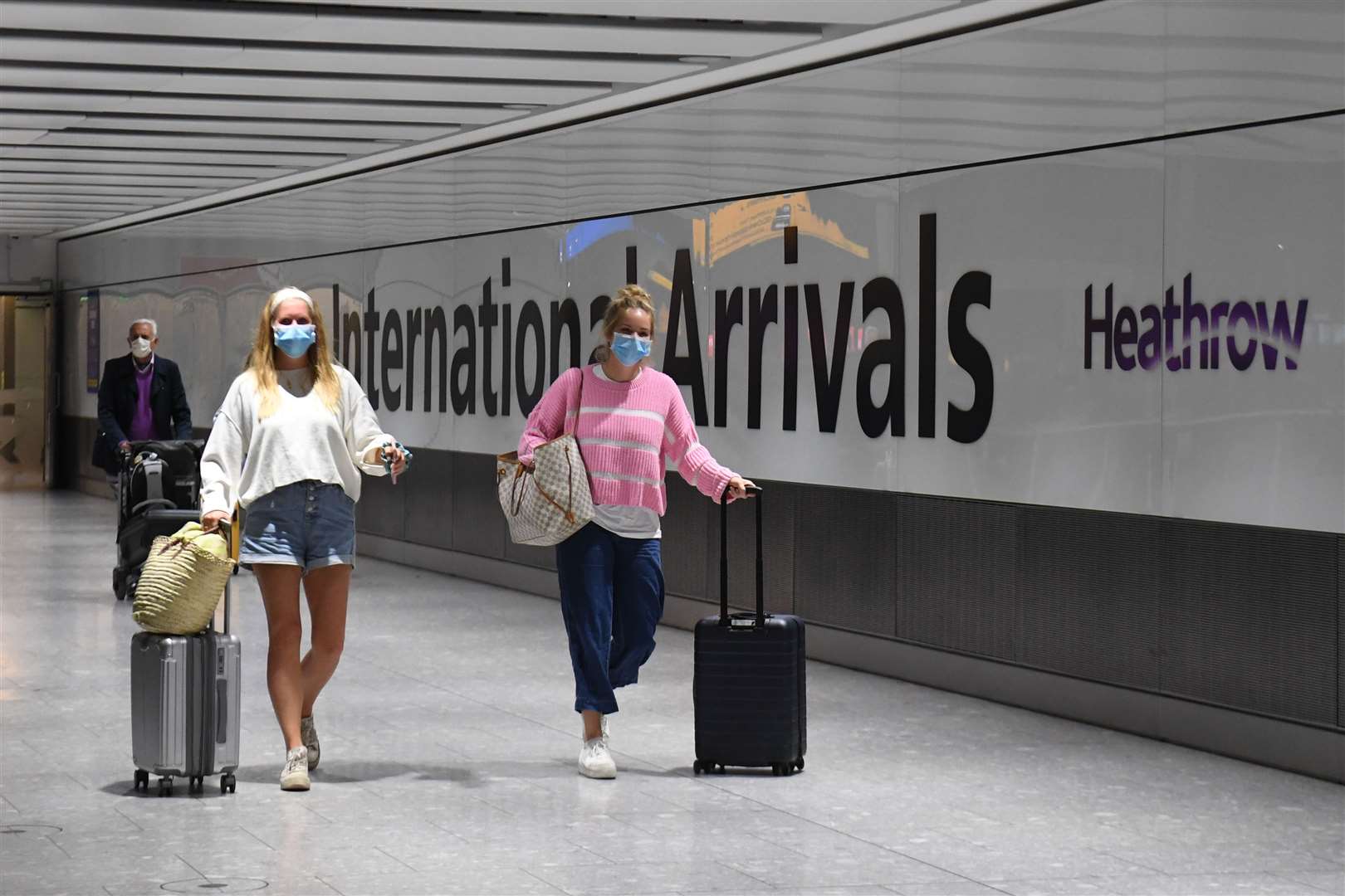 Passengers wearing face masks as they arrive at Heathrow Airport after a flight from Dubrovnik, Croatia, landed (Kirsty O’Connor/PA)