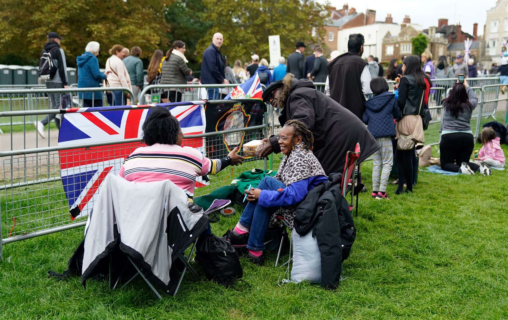 Members of the public set up chairs next to barriers on the procession route along the Long Walk in Windsor, Berkshire (Andrew Matthews/PA)