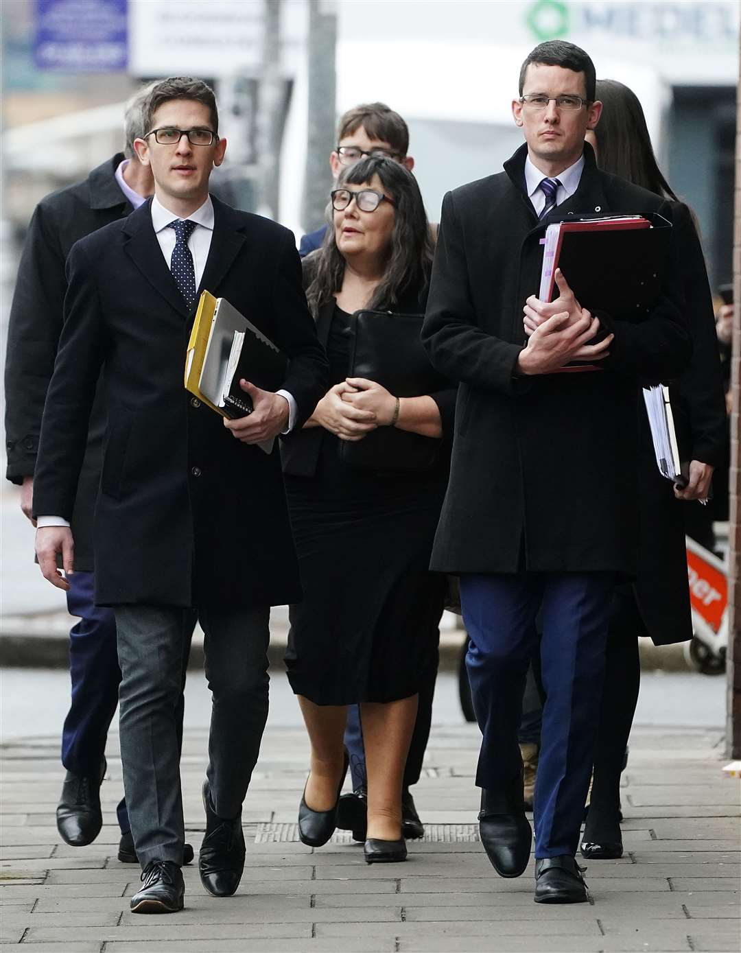 Enoch Burke (right) accompanied by his mother Martina (centre), brother Isaac (left) and other family members, arrive at court (Brian Lawless/PA)