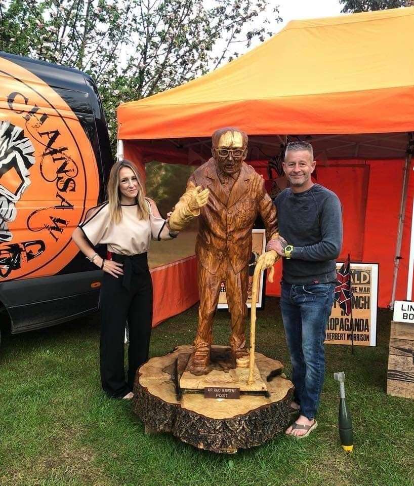 Adele Dunham and Simon Bogg with the wood carving of Sir Tom last year (Hannah-Jayne King)