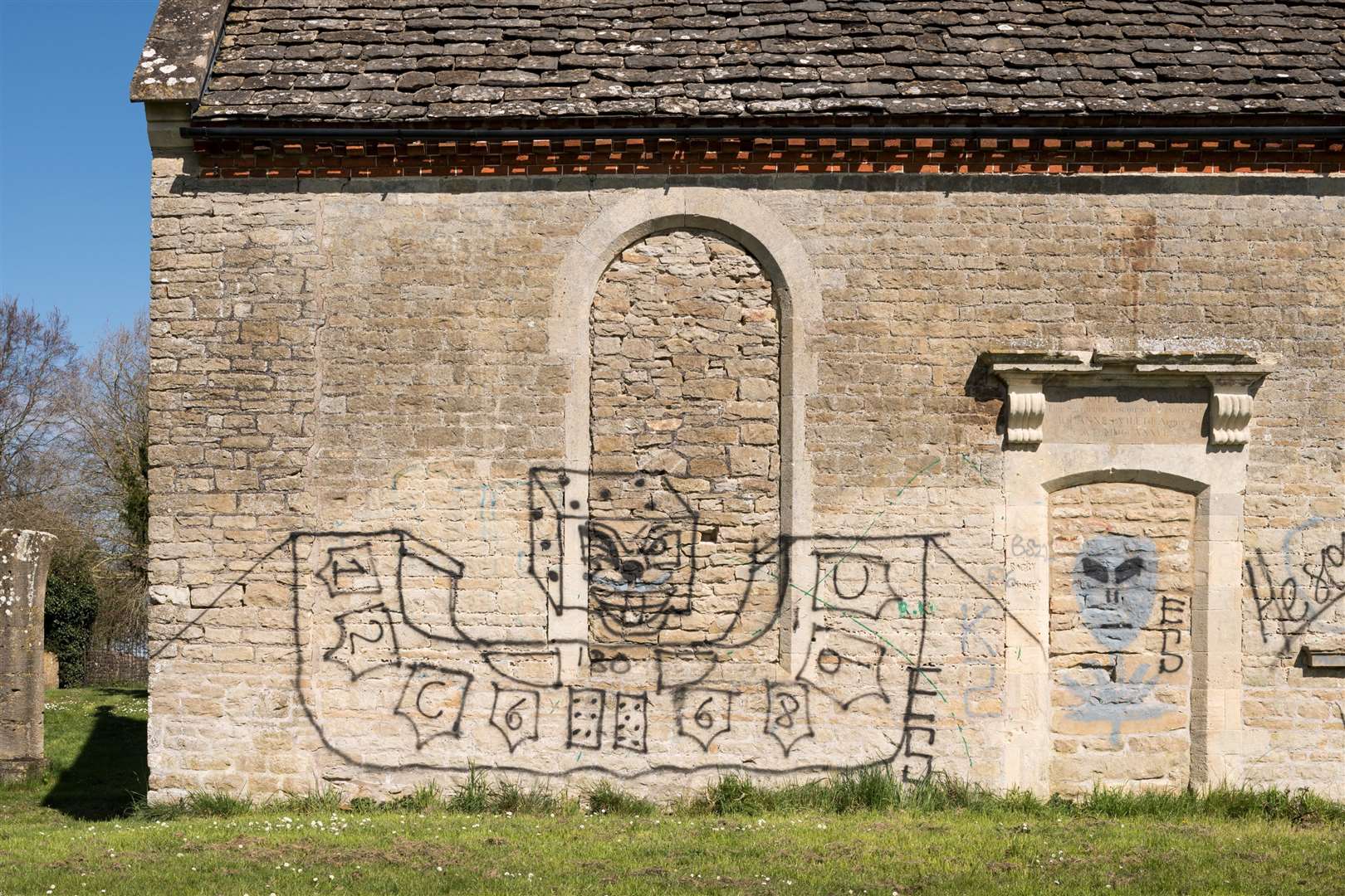 Graffiti on the side of Holy Rood Chapel in Swindon, Wiltshire (Historic England/PA)