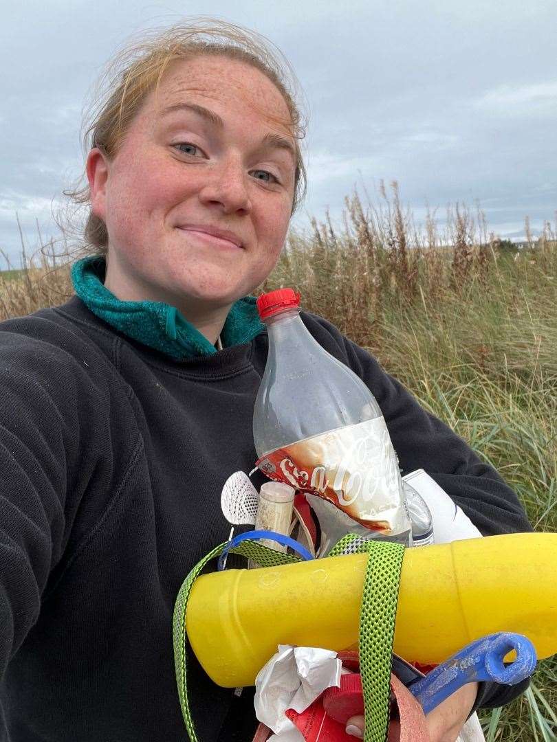 Laura Young with litter she has collected from a beach.