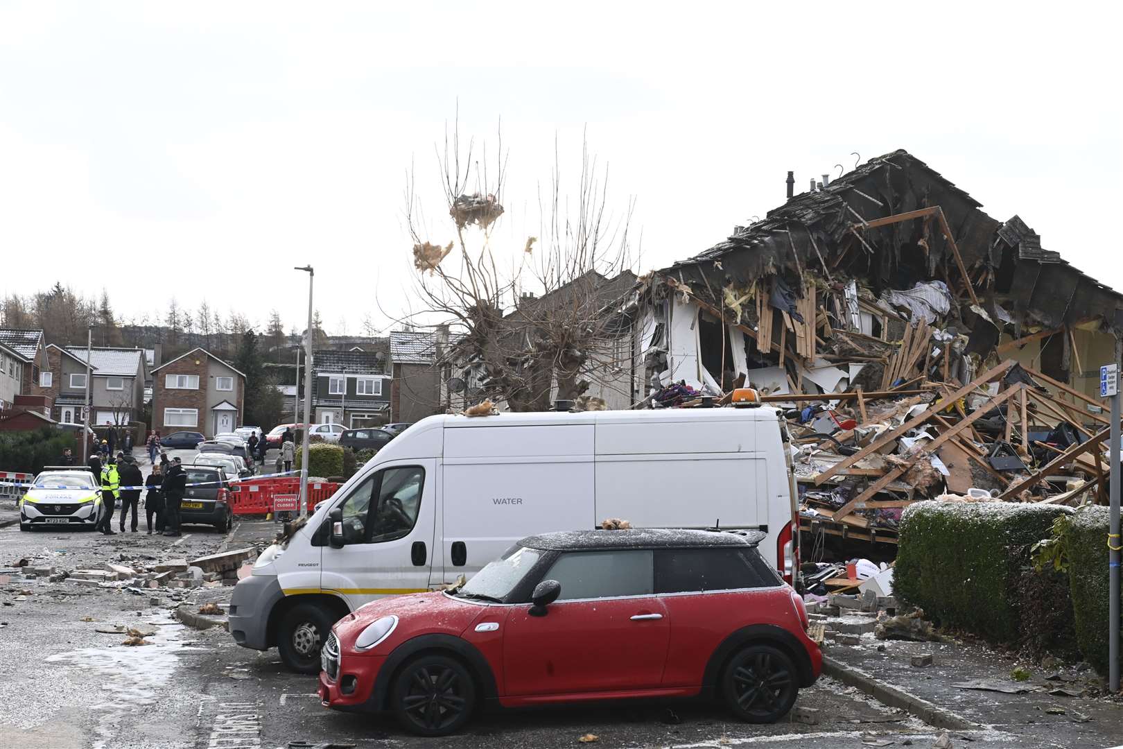 Rubble was strewn across the street (Lesley Martin/PA)