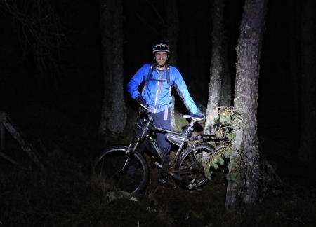 John enjoys his ride into the darkness in the woods around Dunain Hill near Inverness.