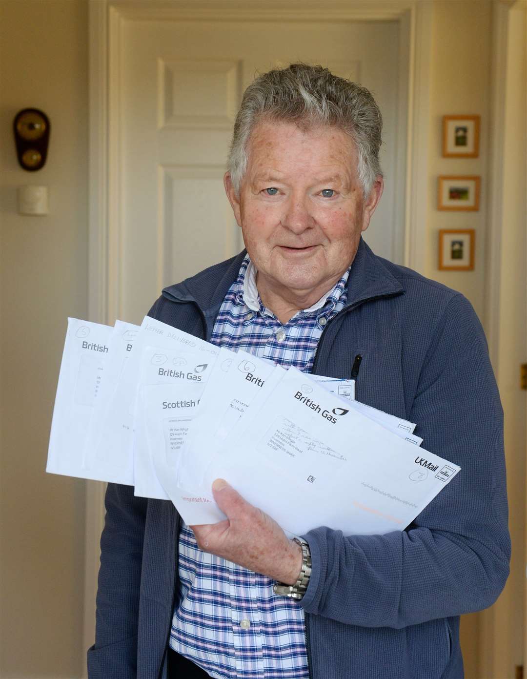 Inverness pensioner Ken Whyte has been having long running dispute with British Gas over payment of carbon monoxide gas alarm that he had fitted..Ken Whyte with the letters from British Gas..Picture: Gary Anthony..