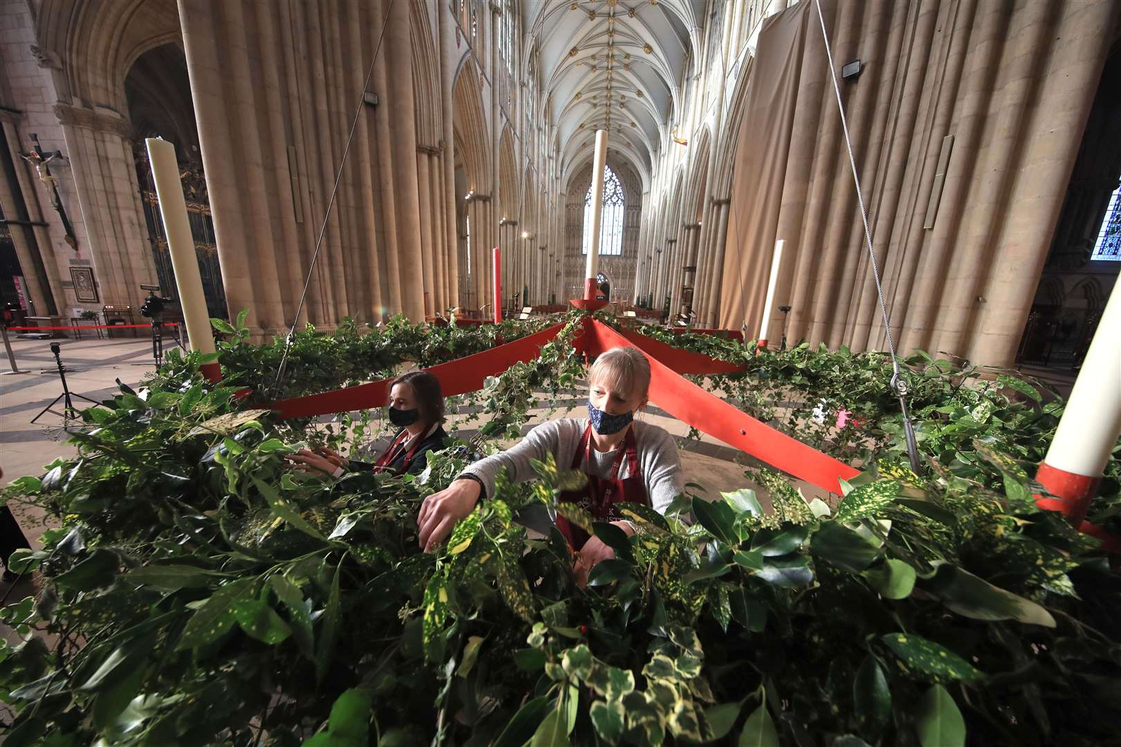 Staff prepare the Advent wreath prior to it being raised to its traditional position (Danny Lawson/PA)
