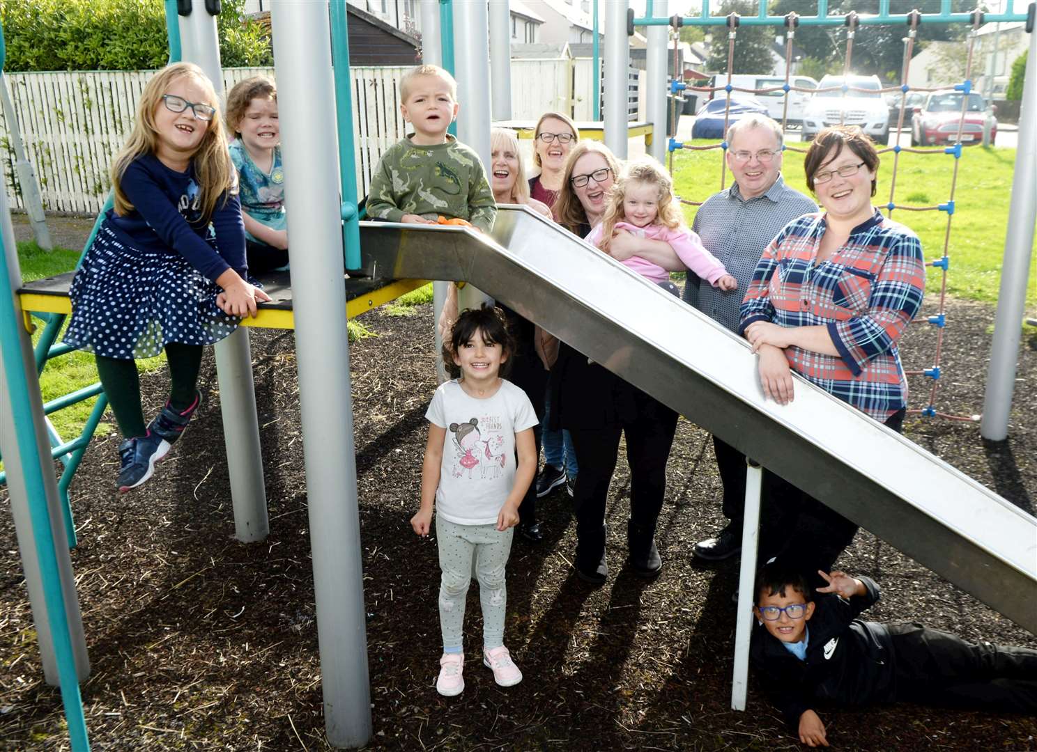 Orchard Park in Beauly: Helen Carmichael, local councillor, Angela Black, Iren Simon, locals, David Fraser, local councillor and Laura Pranaitiene, local with the local children.Picture: James Mackenzie.