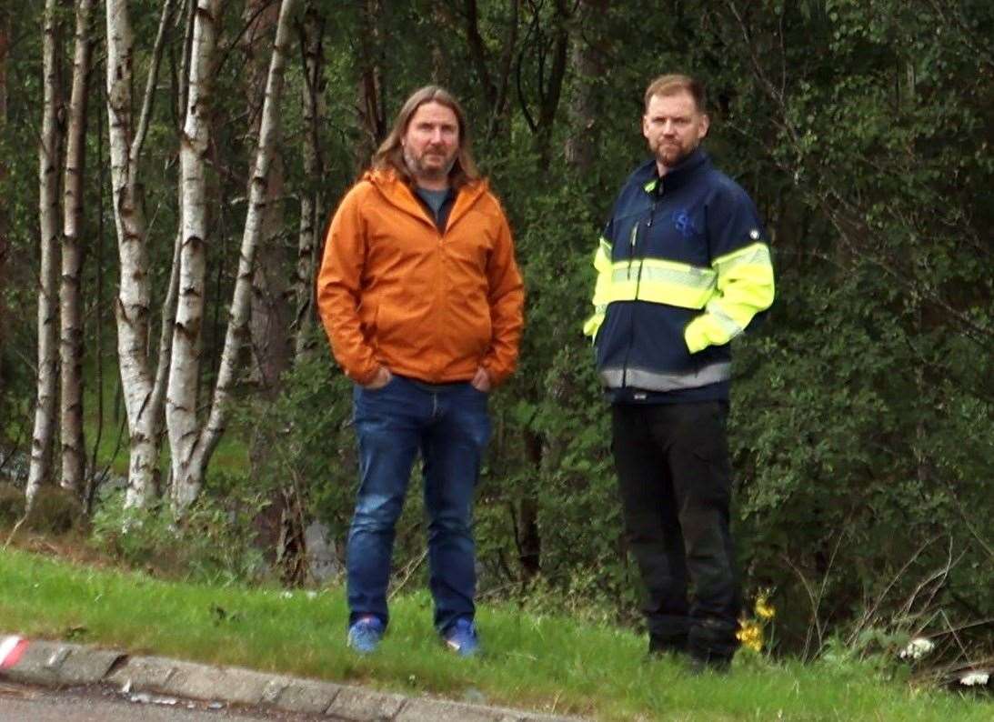 Action needed now: Councillor Jones (left) and Norman Campbell are dwarfed by the trees at the junction
