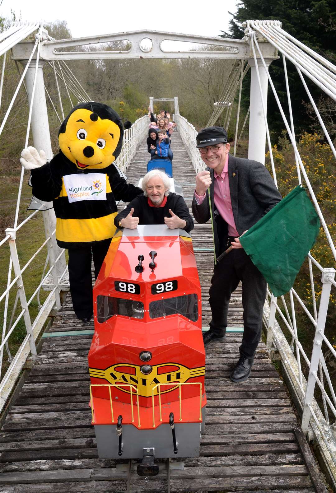 Hospice fundraising director Andrew Leaver (right), train driver Alasdair Macleod and Bobby the Bee with the miniature railway. Picture: Gair Fraser. Image No. 043719.