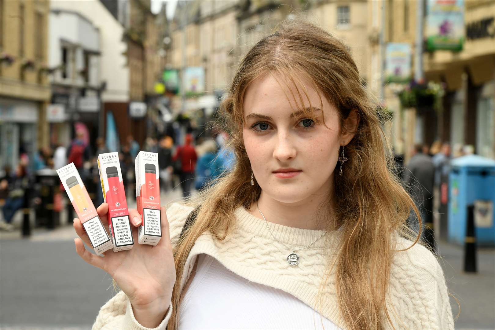 Iona MacDonald holding the e-cigarettes she was able to purchase. Picture: James Mackenzie.
