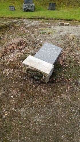 A fallen gravestone at Tomna-hurich Cemetery.