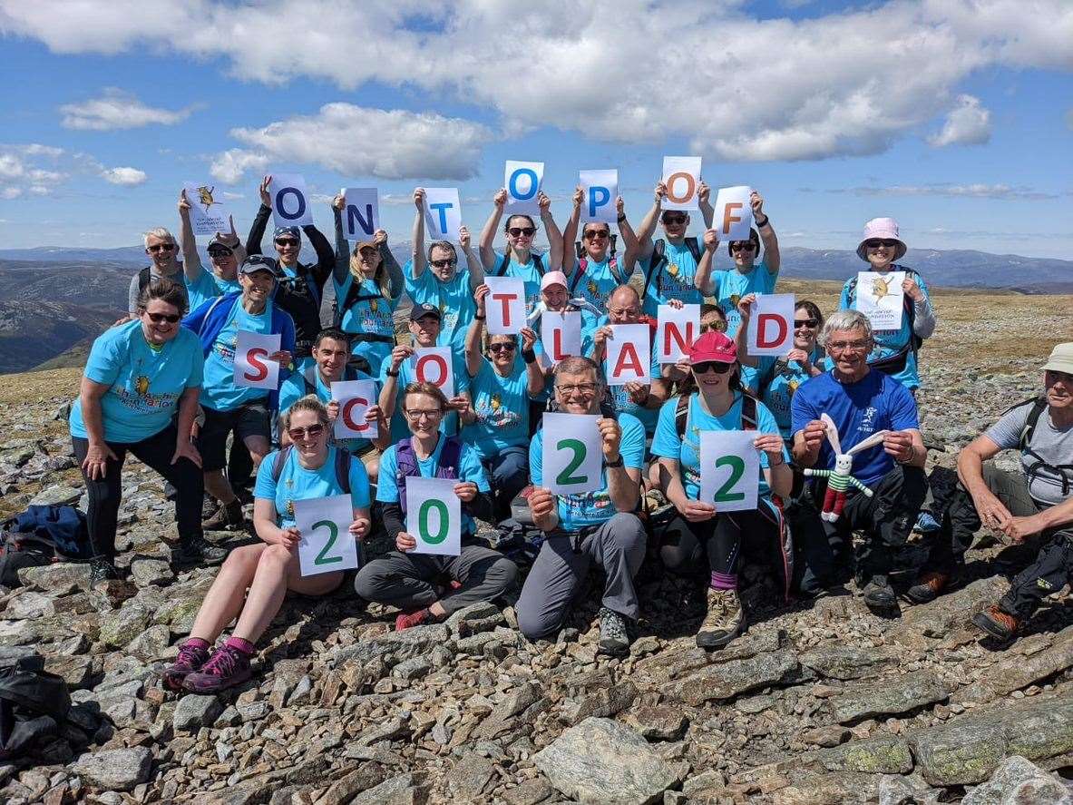 Team of 24 Royal Aberdeen Children's Hospital Staff on top of Cairn o Classie.