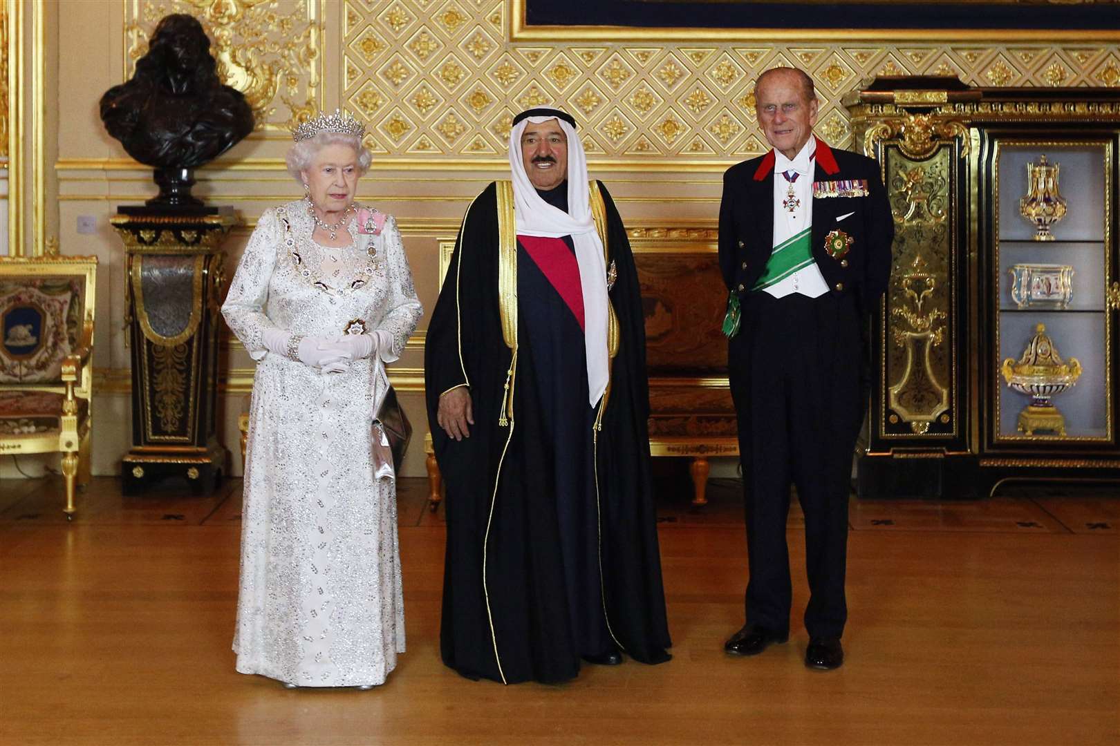 Sheikh Sabah Al Ahmad Al Jaber Al Sabah with the Queen and the Duke of Edinburgh ahead of a state banquet at Windsor Castle (Oli Scarff/PA)