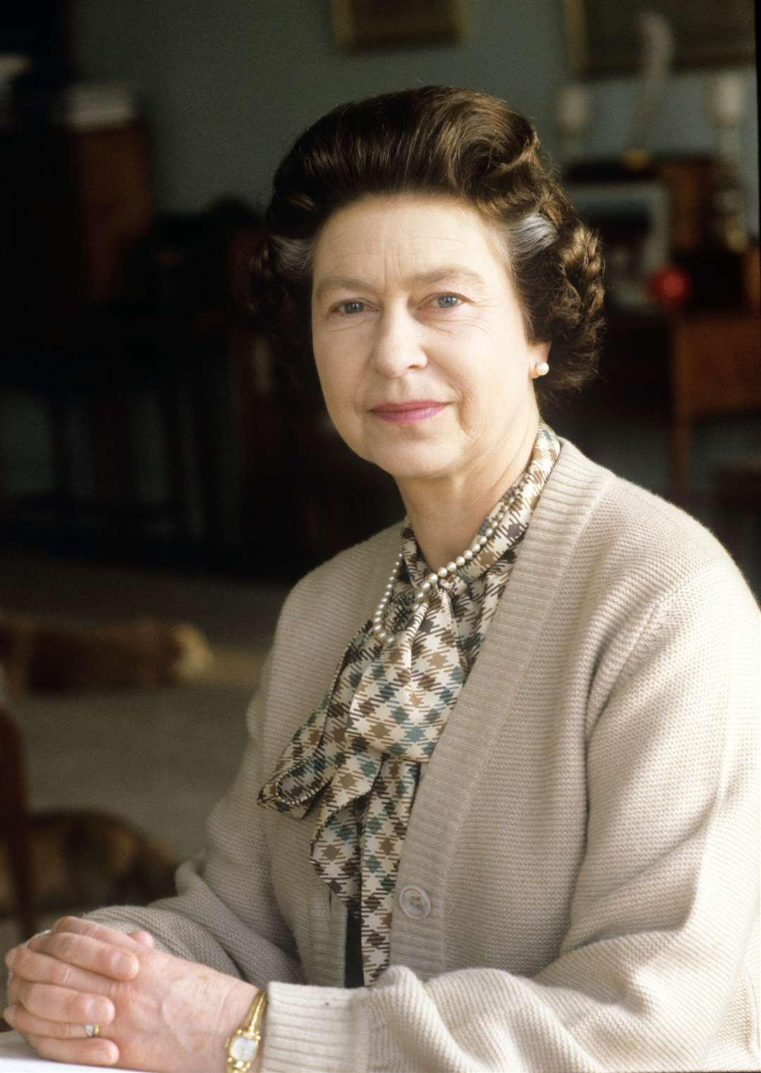 The monarch – with two streaks of grey hair – at her desk in the study of Sandringham House in Norfolk in February 1982 as she marked 30 years on the throne (Ron Bell/PA)
