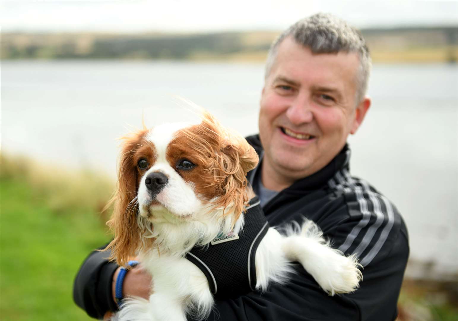 Gary Campbell, of Dingwall, with Harley, his Blenheim Cavalier King Charles Spaniel. Picture: James Mackenzie.
