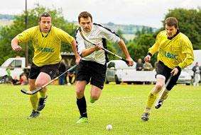 Lovat's Ryan Ferguson is flanked by Bute players Hector Whitelaw (left) and David Whitelaw (right) as they attempt to gain possession.