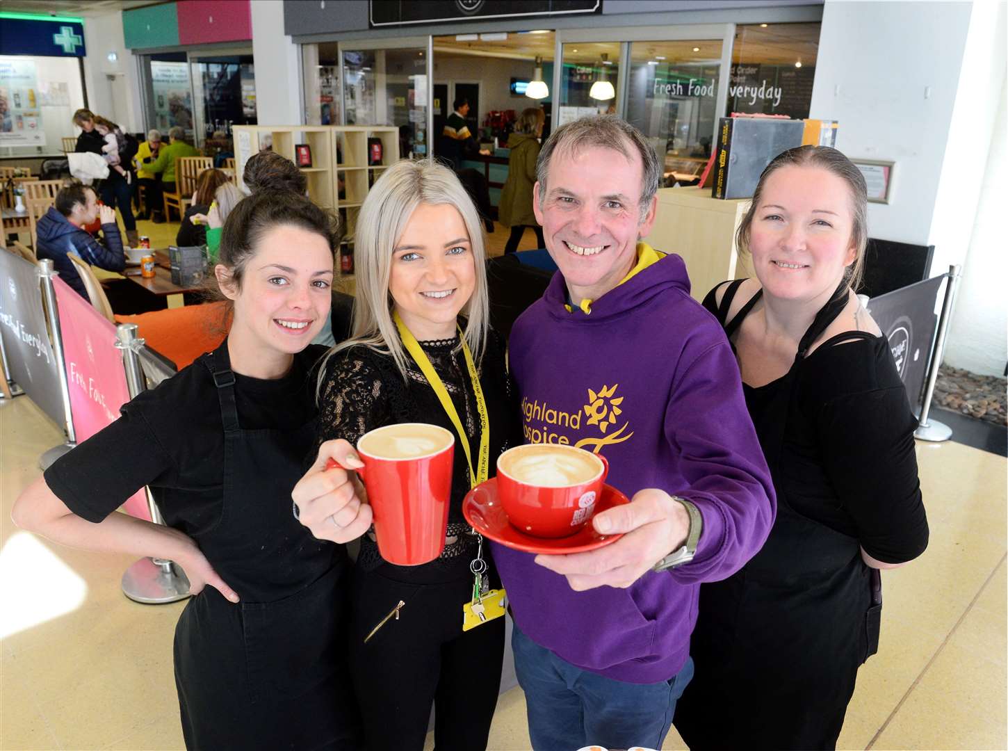 Archie regional fundraising officer Dawn Cowie serves a final cup of coffee to Highland Hospice head of fundraising Andrew Leaver, with supervisor Eilish McGlynn (left) and café manager Caroline Black. Picture: Gary Anthony