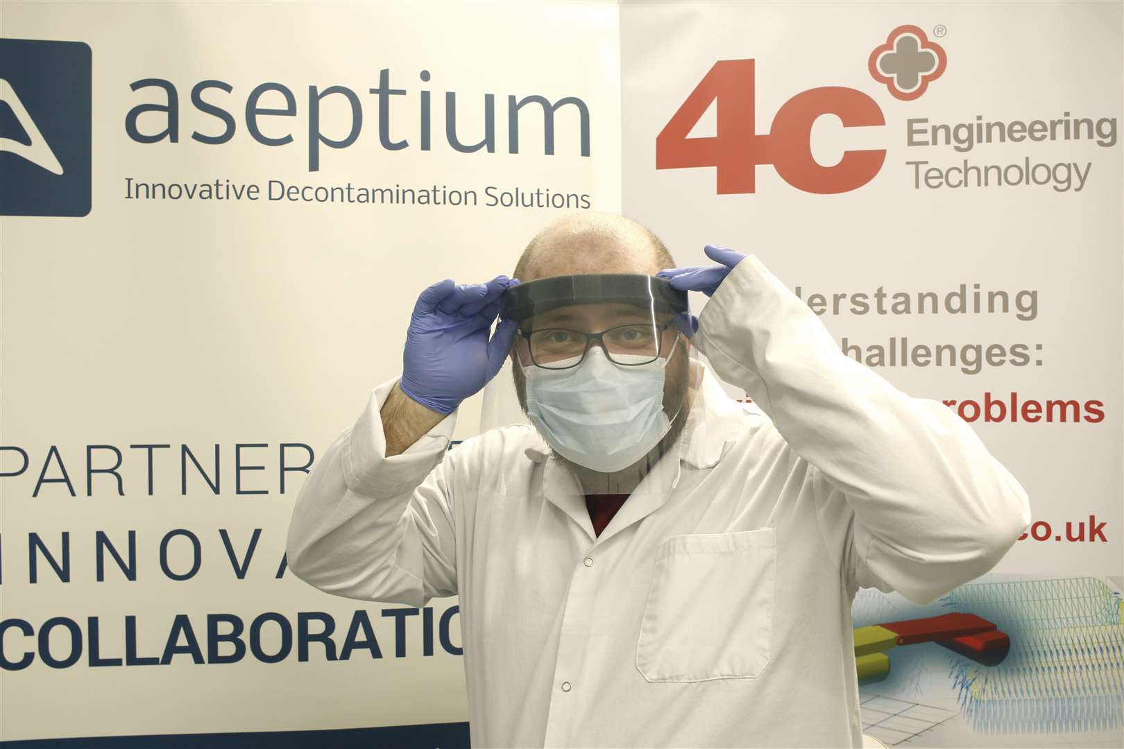 Pawel de Sternberg Stojalowski of Aseptium models one of the face shields now protecting staff at Raigmore Hospital.