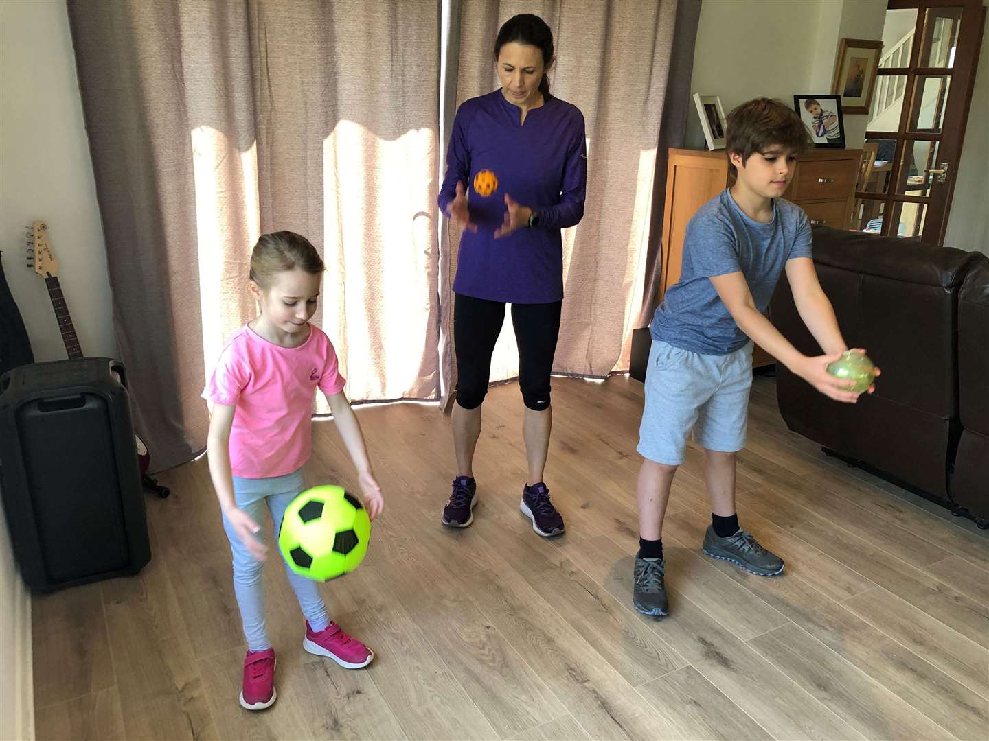Jo Pavey gets her children involved with some indoor exercise. Picture: Gavin Pavey/PA