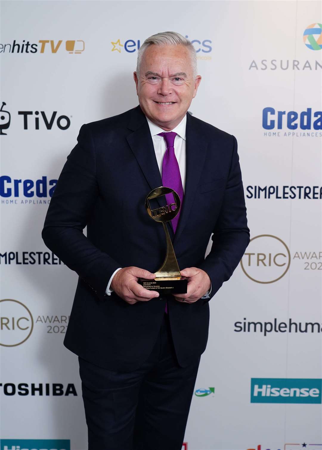 Huw Edwards with the Live Event award for the State Funeral of the late Queen at the Tric awards at the Grosvenor House Hotel earlier this year (Ian West/PA)