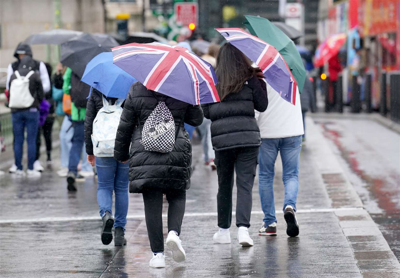 People enduring the rainy conditions (PA)