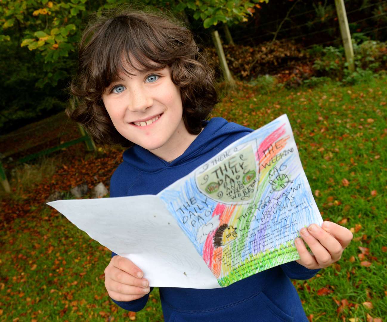 Ewan Karim(9) with his The Daily Page newspaper...Picture: Gary Anthony..