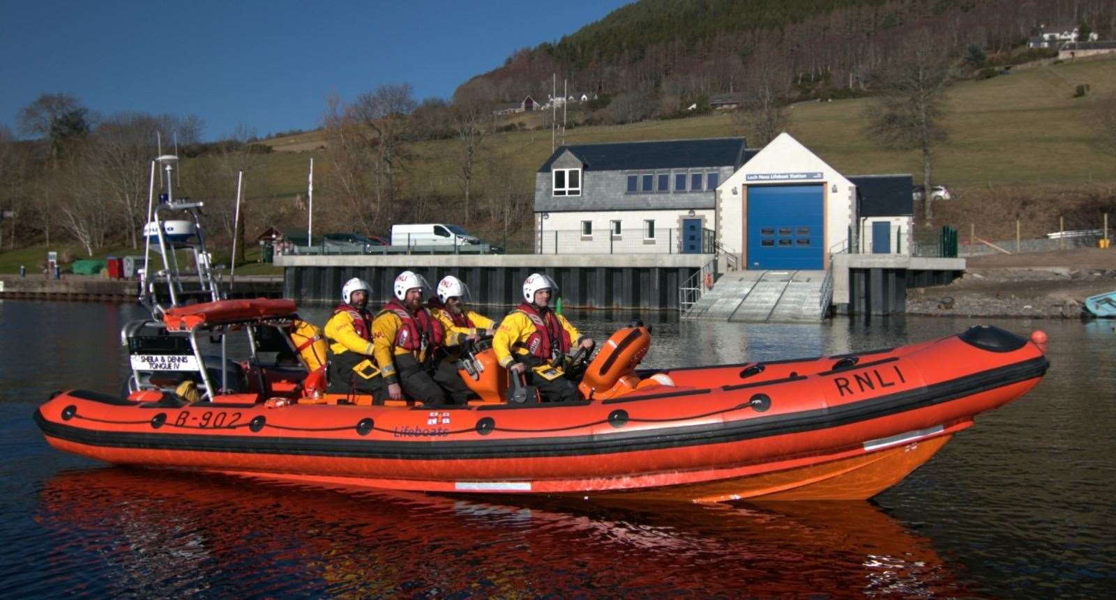 The Loch Ness lifeboat on the water in front of the station.
