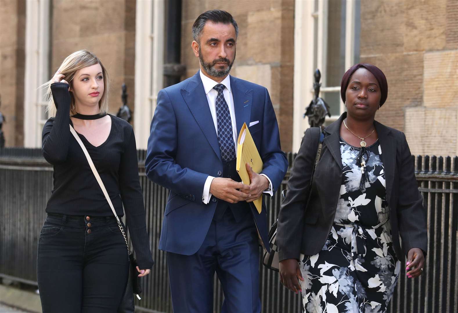 Sheku Bayoh’s partner Collette Bell and his sister Kadi Johnson with solicitor Aamer Anwar (Andrew Milligan/PA)
