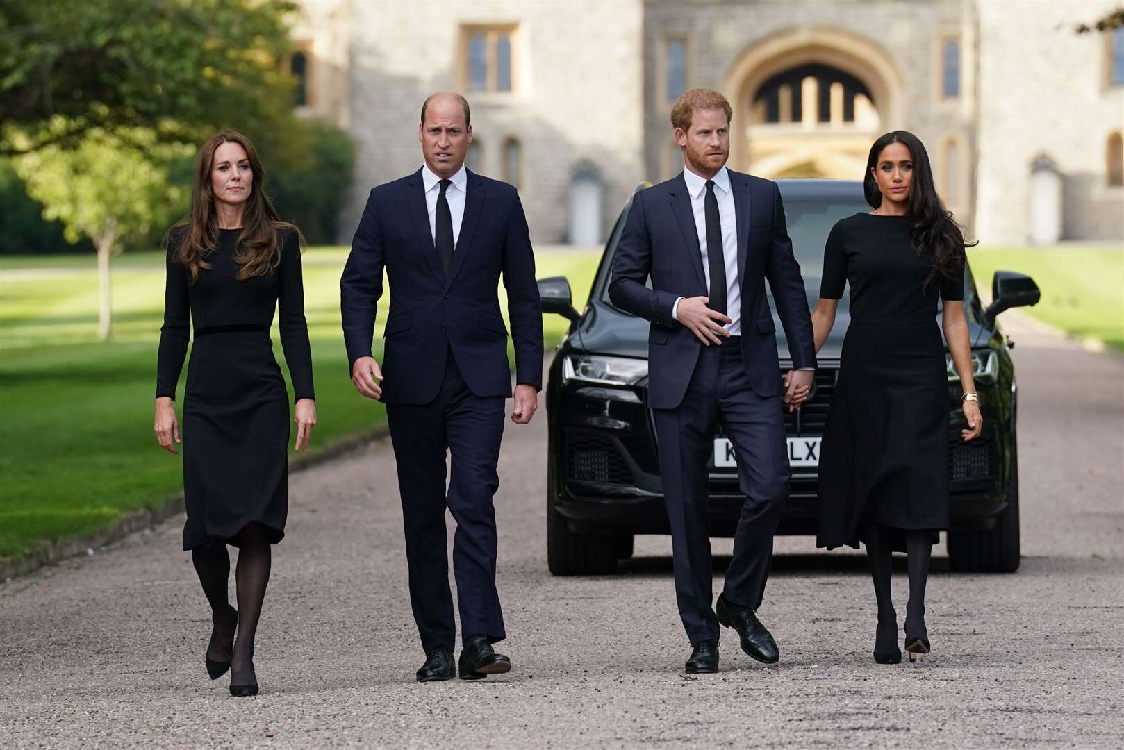 The Princess of Wales, the Prince of Wales and the Duke and Duchess of Sussex walk to meet members of the public at Windsor Castle in Berkshire following the death of Queen Elizabeth II (Kirsty O’Connor/PA)