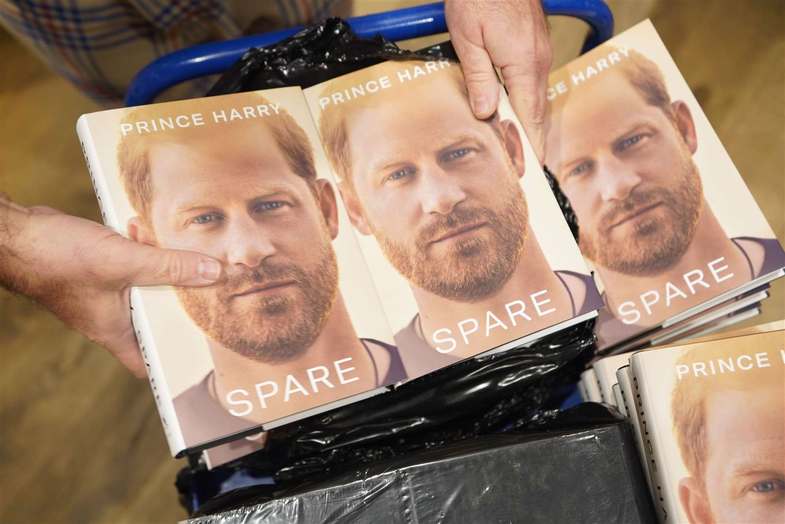 Staff unwrapping copies of Harry’s autobiography at Waterstones Piccadilly in January (James Manning/PA)