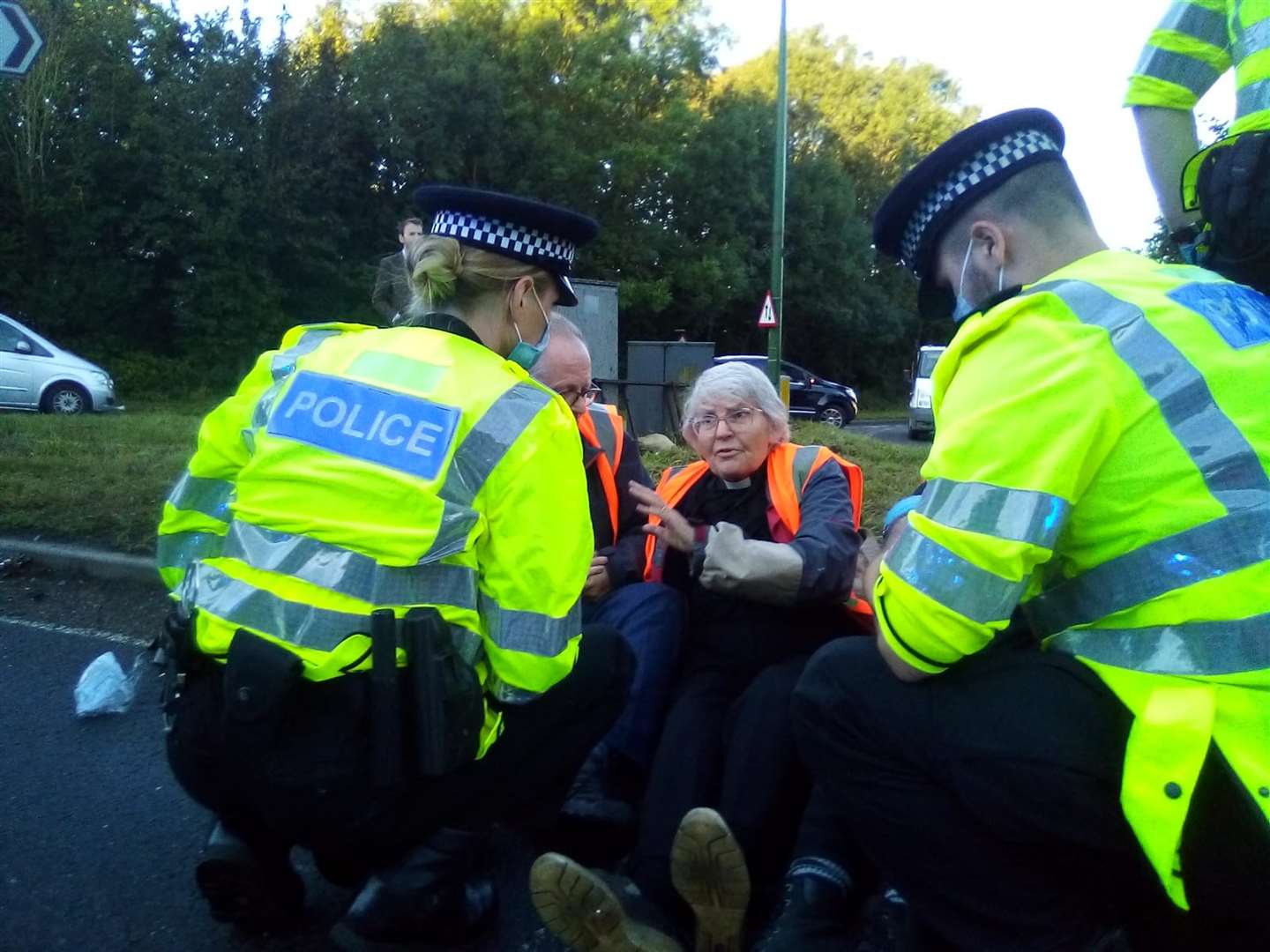 An Insulate Britain protester blocking a roundabout at Junction 3 of the M25 (Insulate Britain/PA)
