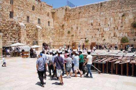 The Wailing Wall in Jerusalem with a bar mitzvahs taking place.