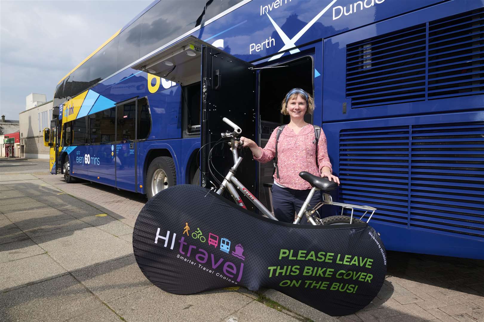 Vikki Trelfer, active travel officer at HiTrans, demonstrating the Bikes on Bus service.