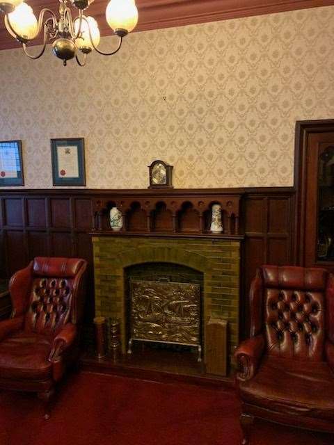 The fireplace where the picture used to hang.