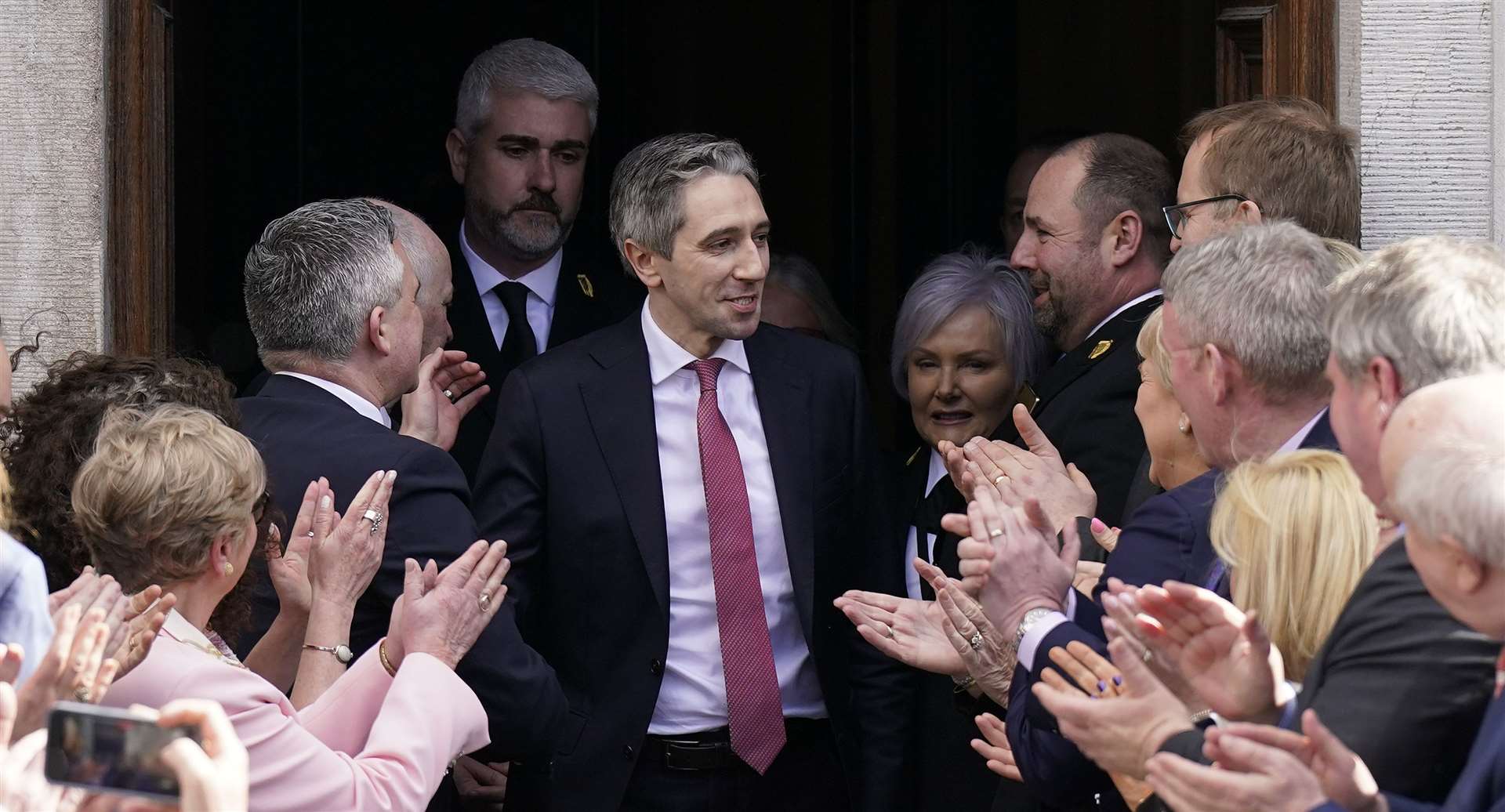 Newly elected Taoiseach Simon Harris leaves the Dail, in Dublin, following the vote by Irish parliamentarians to elect him, making him the youngest Taoiseach in the Republic of Ireland’s history (Niall Carson/PA)