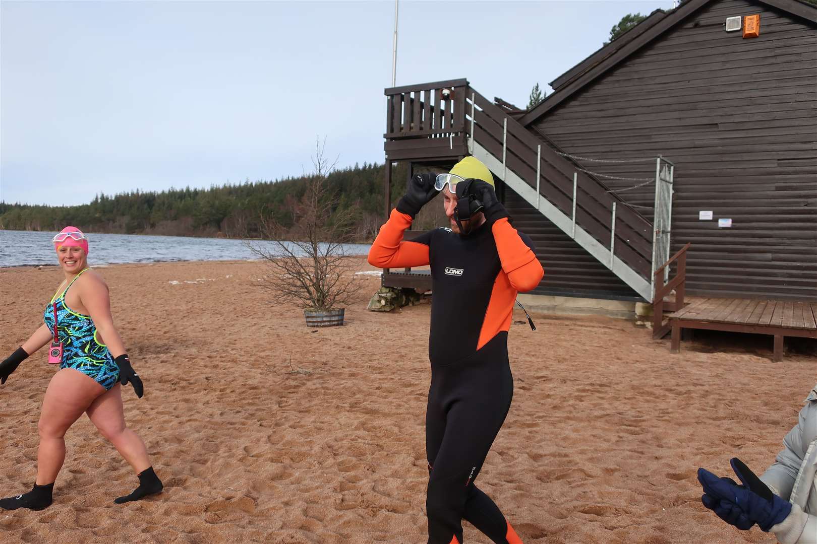 John prepares for the water ont he beach at Loch Morlich, with Alice Goodridge (left).