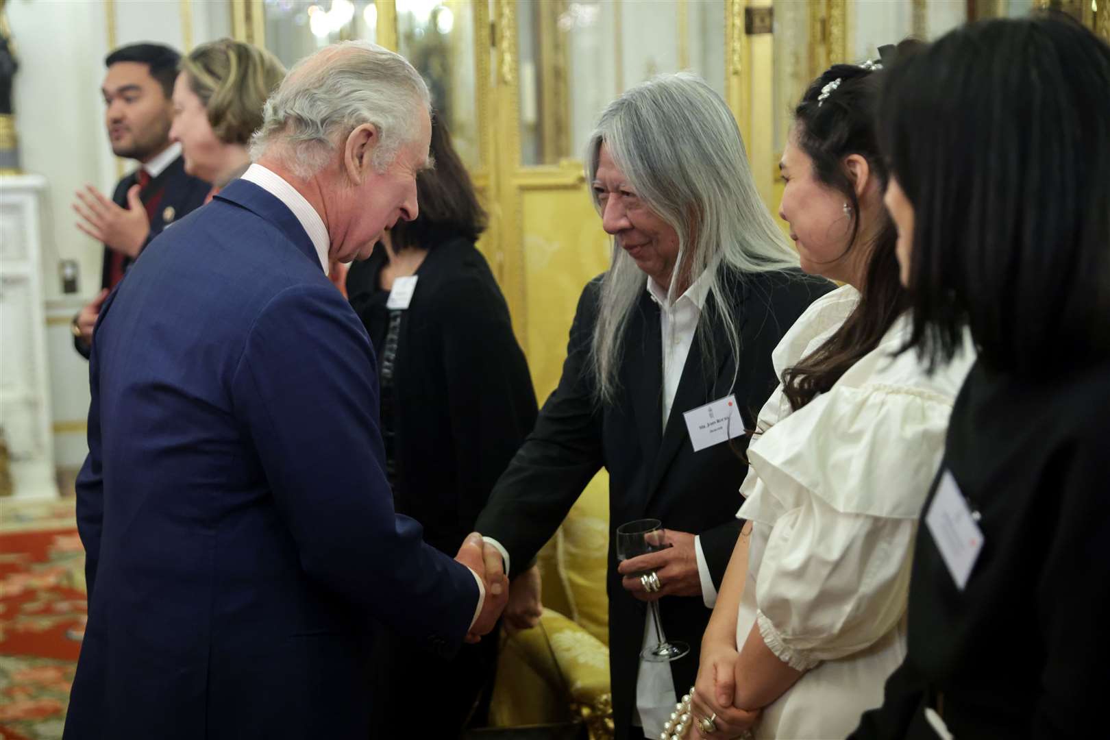 Designer John Rocha greeted the King at Buckingham Palace (Chris Jackson/PA)