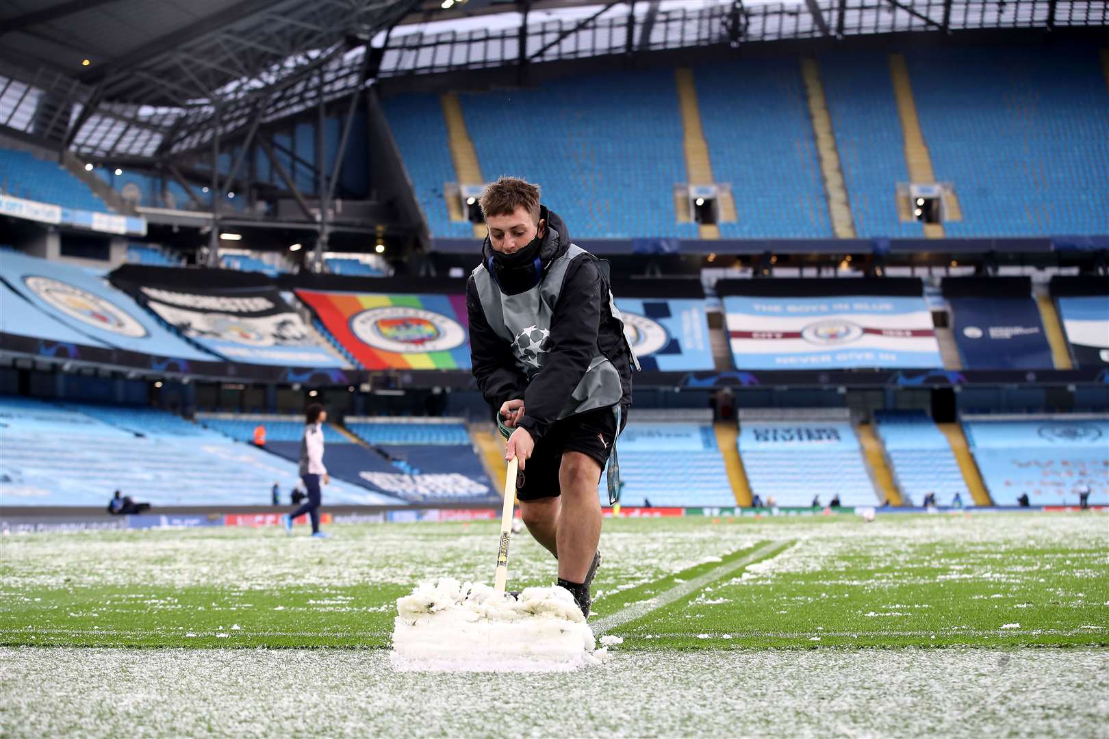 The wintry conditions meant extra work for ground staff at the Etihad Stadium (Martin Rickett/PA)