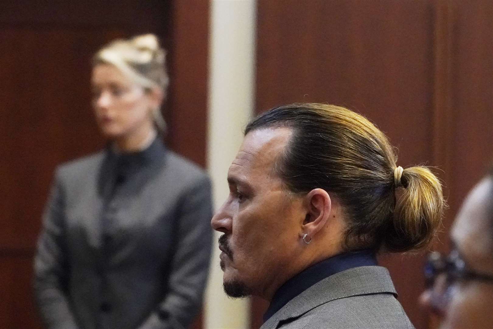 The jury was shown photographs in which Ms Heard appeared to have marks on her arms, which she said were scars caused by Mr Depp (Steve Heber/AP)