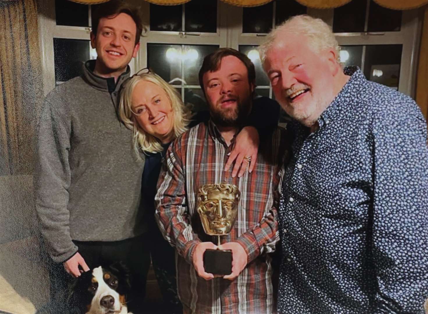 James Martin with his brother Daniel, mother Suzanne and father Ivan with his Bafta for An Irish Goodbye (Family handout/PA)