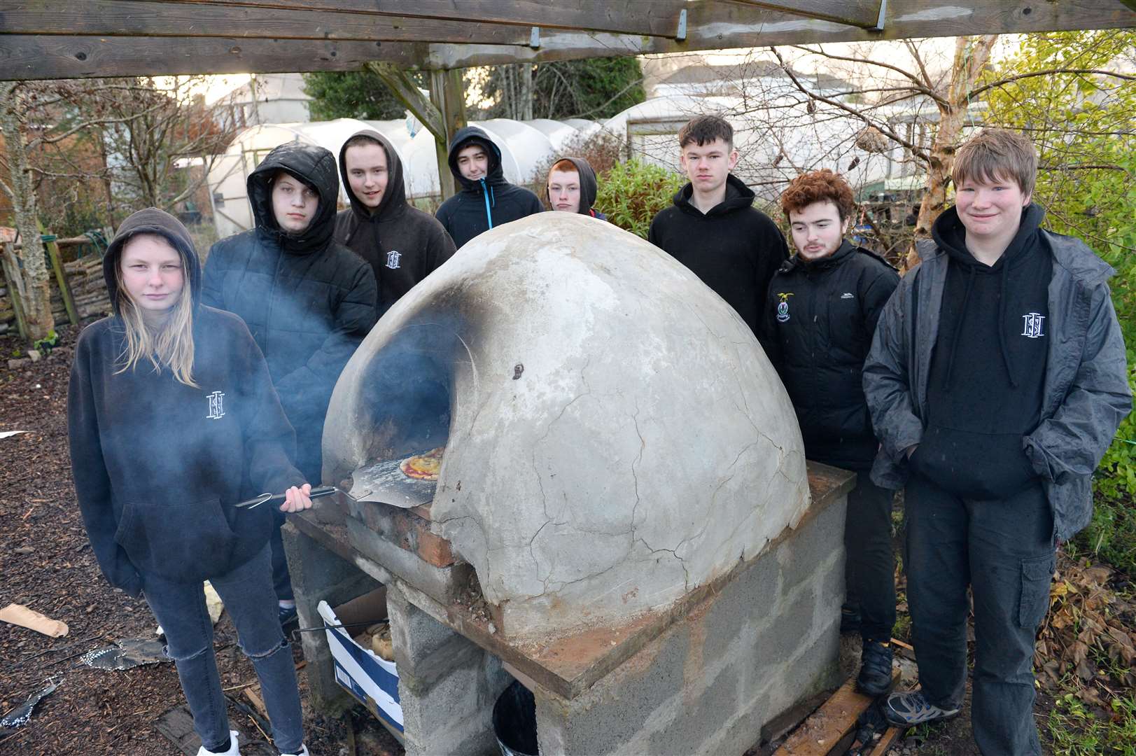 Inverness High School students with pizza oven built as part of school's food education.
