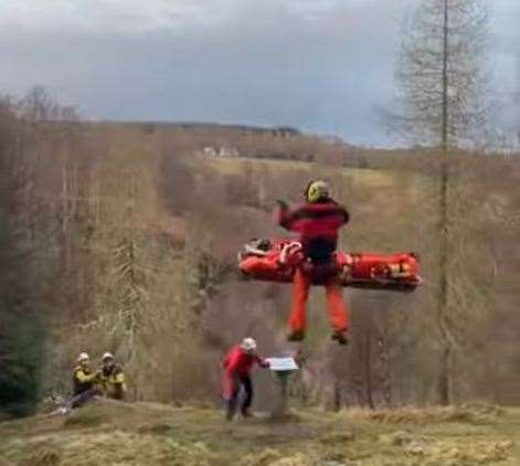 The stretchered casualty at Huntly's Cave near Grantown on Spey is airlifted to safety after the Cairngorm MRT and HM Coastguard operation.