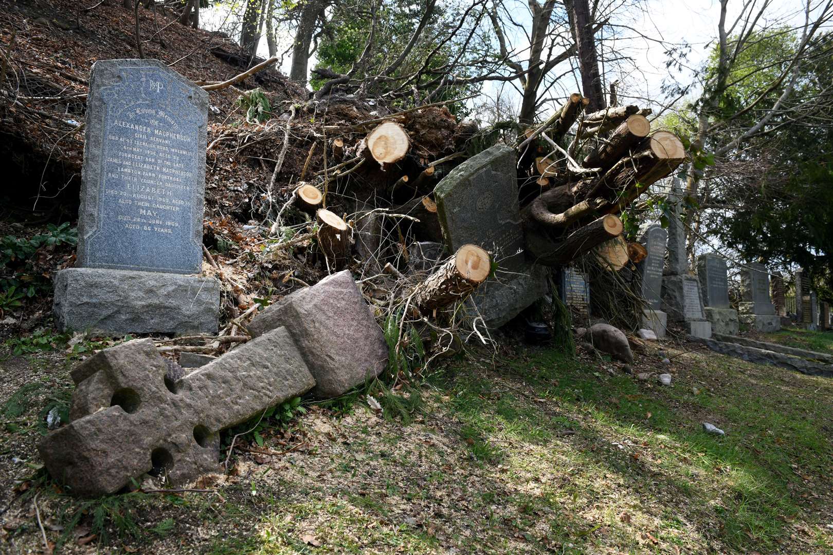 Fallen trees have damaged gravestones in Tomnahurich Cemetery, Inverness.