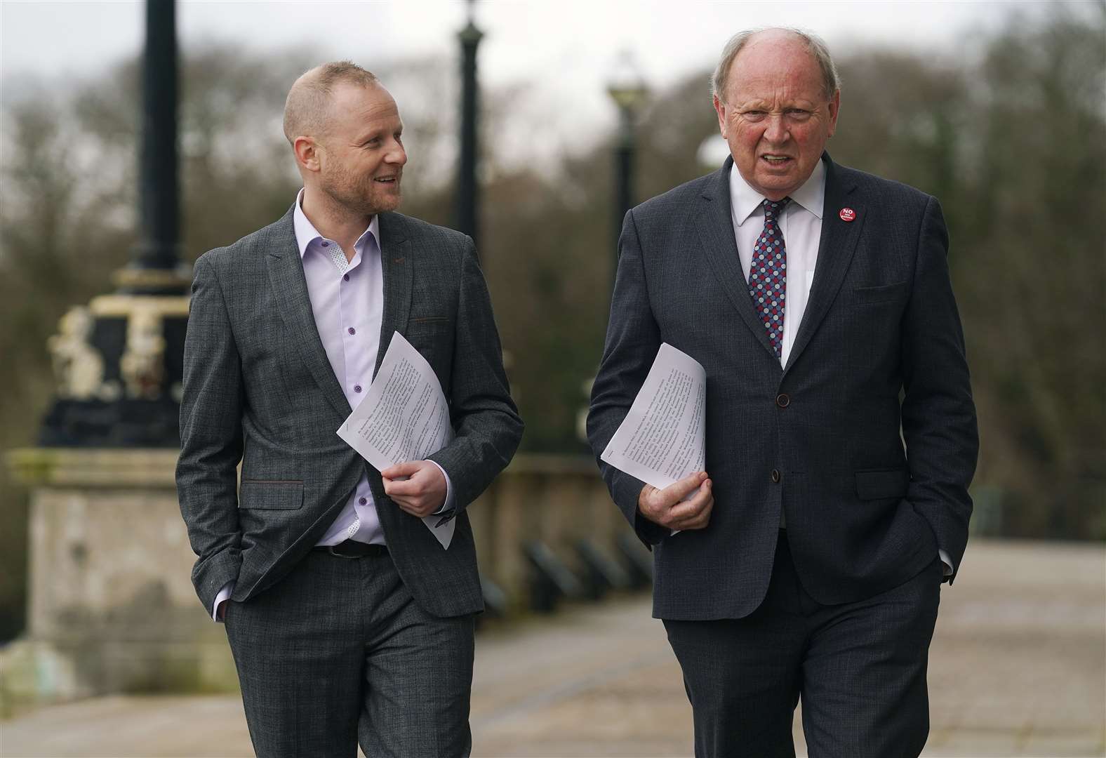 Loyalist activist Jamie Bryson and TUV leader Jim Allister on the steps of Stormont (Brian Lawless/PA)