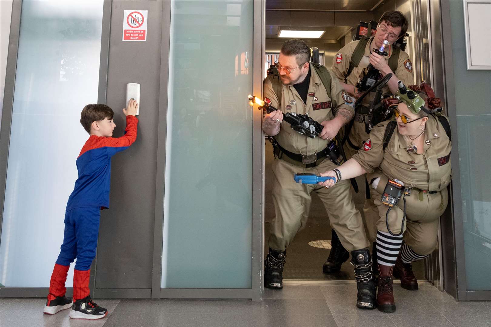 The Ghostbusters encounter a mini Spider-Man at a past Comic Con event.