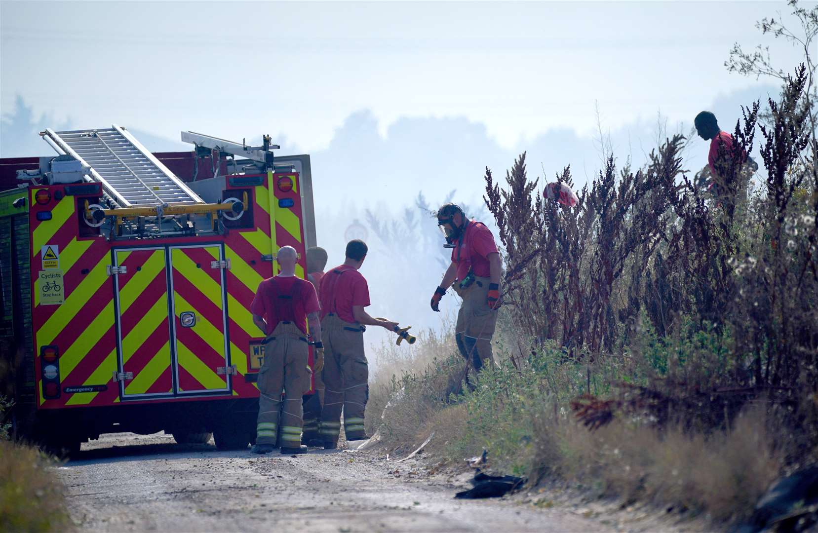Firefighters tackle a blaze in the village of Wennington (Yui Mok/PA)