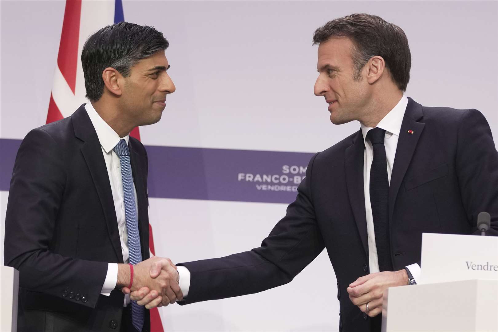 French President Emmanuel Macron, right, has insisted any returns deal must be UK-EU wide (Kin Cheung/PA)