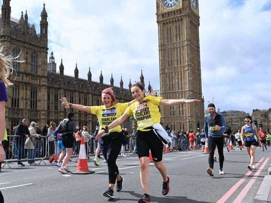 Two girls running past Big Ben while taking part in this year's annual half marathon in London. Picture: Highland Hospice.