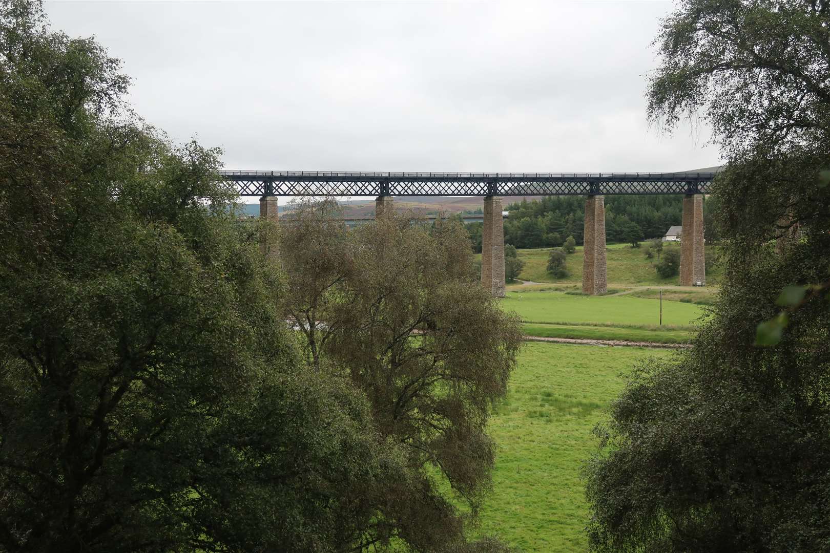 The railway bridge over the Findhorn with the A9 road bridge beyond.