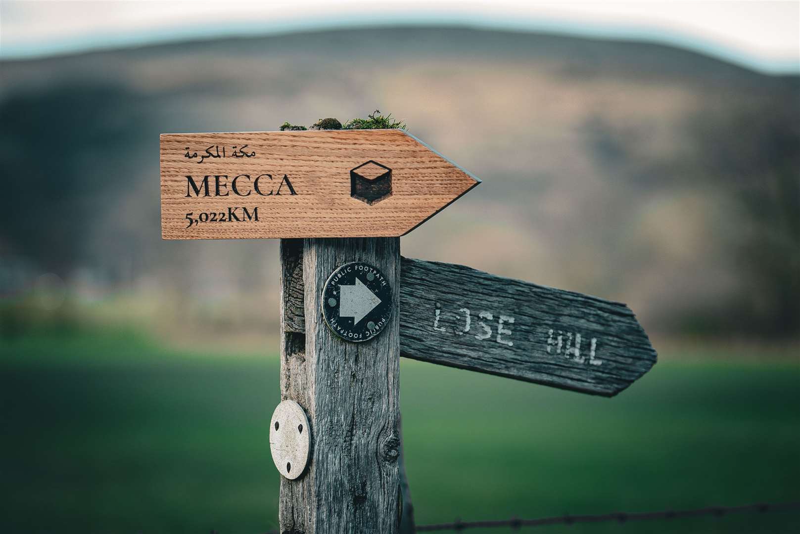 A Mecca sign along one of the Peak District’s most popular hiking routes, Cave Dale (Wiggle/PA)